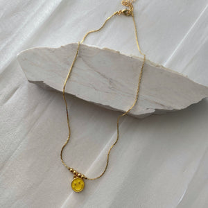 Choker carita amarilla