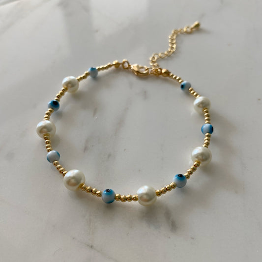 Pulsera ojitos perlas