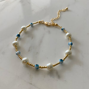 Pulsera ojitos perlas